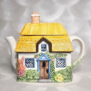 The Village Teapot Collectables" series, specifically the "Summer Cottage"